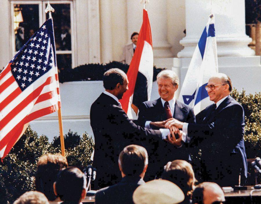 From+left%2C+Egyptian+President+Anwar+Sadat%2C+U.S.+President+Jimmy+Carter+and+Israeli+Prime+Minister+Menachem+Begin+make+a+three-way+handshake+during+the+White+House+signing+of+the+Middle+East+peace+accord+in+March+1979.%C2%A0Photo%3A+The+Carter+Center%2FUsed+With+Permission