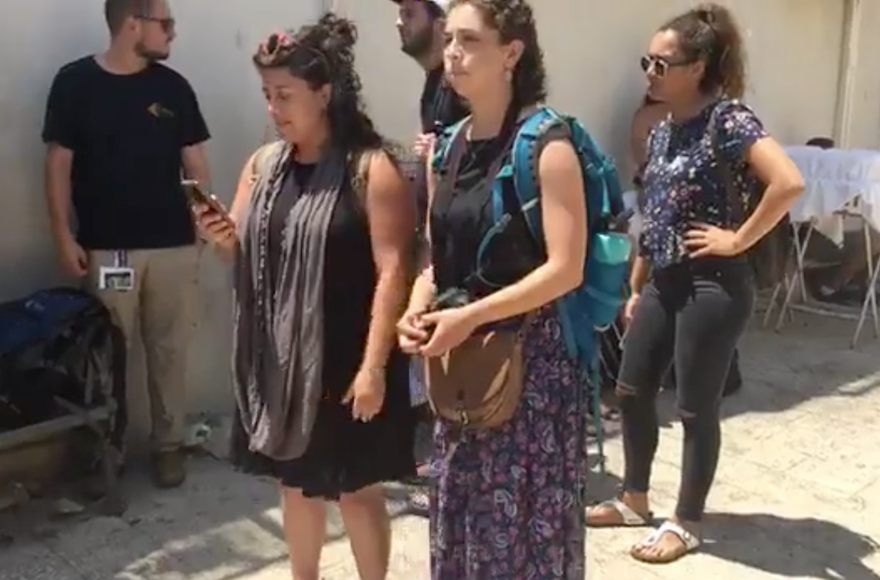 Some Birthright participants filming themselves talking about their reasons for leaving their trip earlier this month. (Screenshot from Facebook)