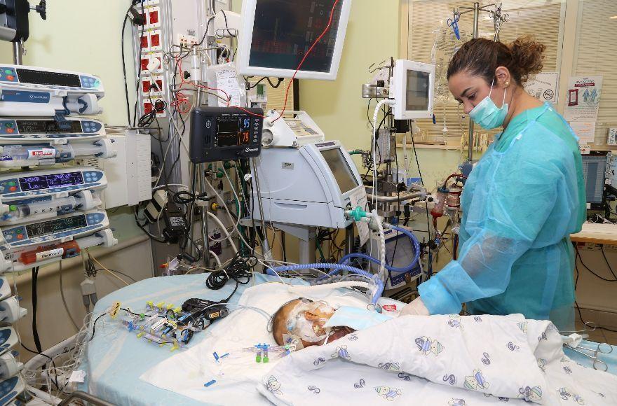 Musa, a Palestinian baby from the West Bank, clings to life at Sheba Medical Center in Tel Aviv after receiving a new heart donated from an Israeli child. (Courtesy of Sheba Medical Center)