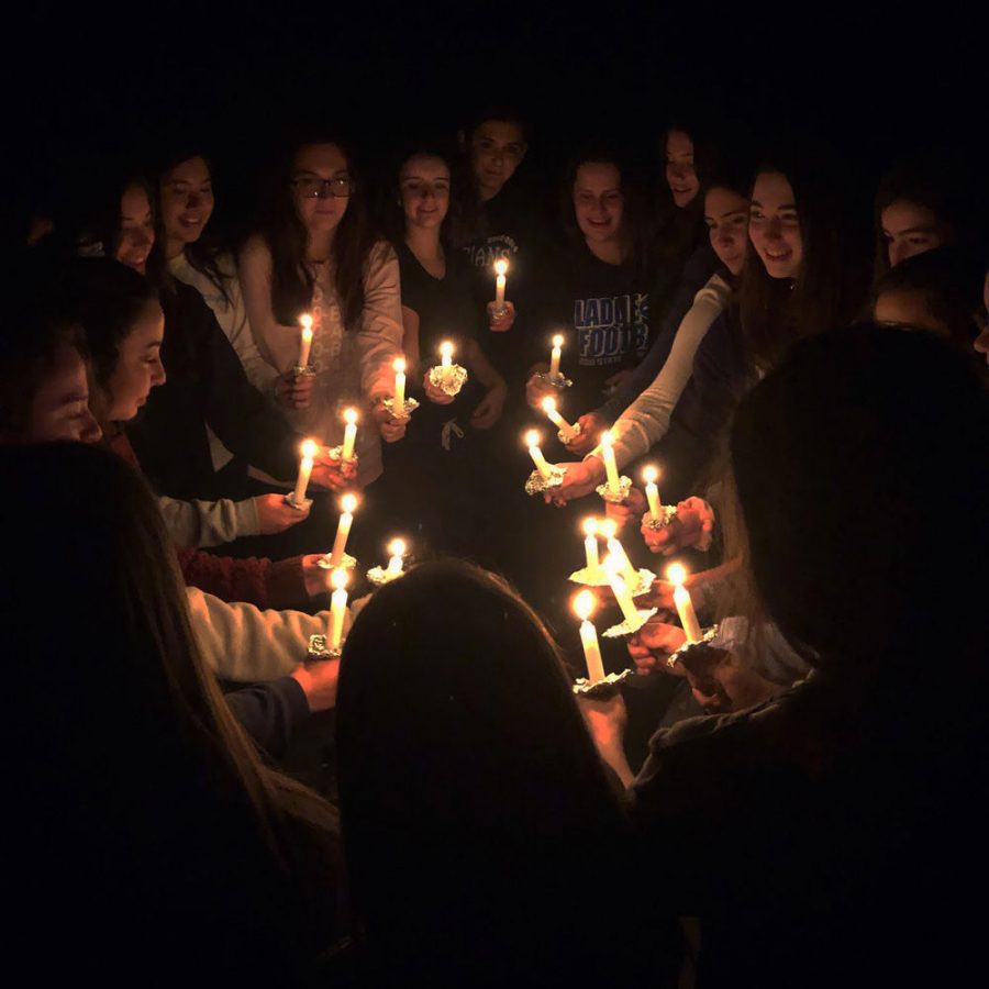 Participants+light+candles+during+their+induction+ceremony+into+BBYO%E2%80%99s+Sababa+chapter+to+make+new+members+official.