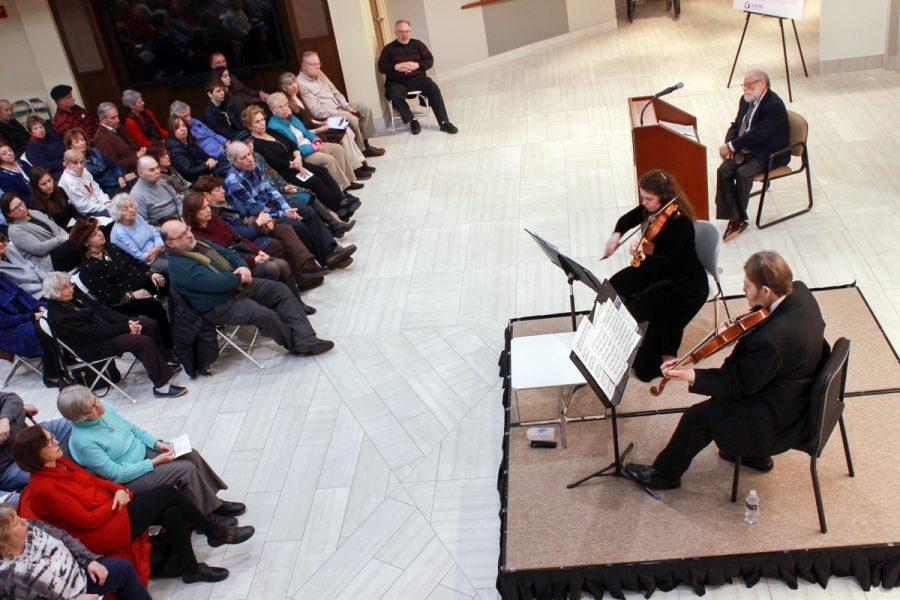 Mischa Braitberg and daughter Tova Braitberg perform on Sunday at the Holocaust Museum and Learning Center during a program about their father and grandfather, Gregor Braitberg, a Holocaust survivor. ‘Gregor’s Violin’ is the title of a new exhibit at the museum. Photo: Eric Berger