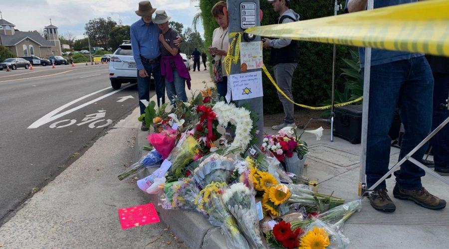Mourners+leave+mementos+across+the+street+from+the+Chabad+Community+Center+in+Poway%2C+California+a+day+after+a+shooter+killed+a+congregant+and+wounded+three+others%2C+on+April+28%2C+2019.+%28Gabrielle+Birkner%29