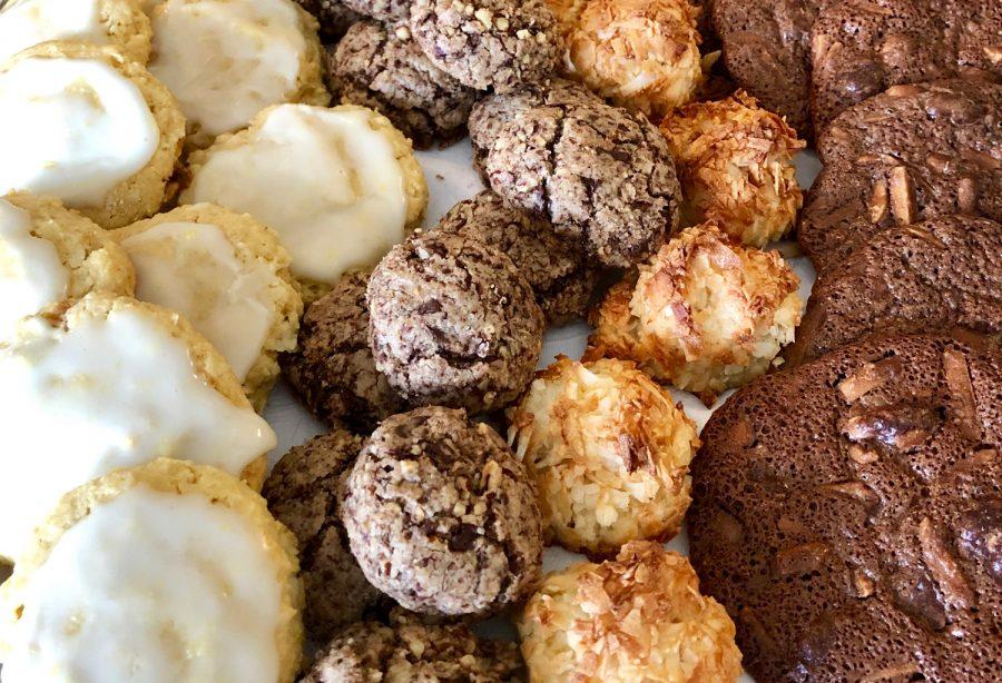 A tray full of Passover cookies includes from left: lemon-glazed almond cookies, chocolate-pecan tea cookies, maple coconut macaroons and chocolate and almond crisps. Photo: Michael Kahn