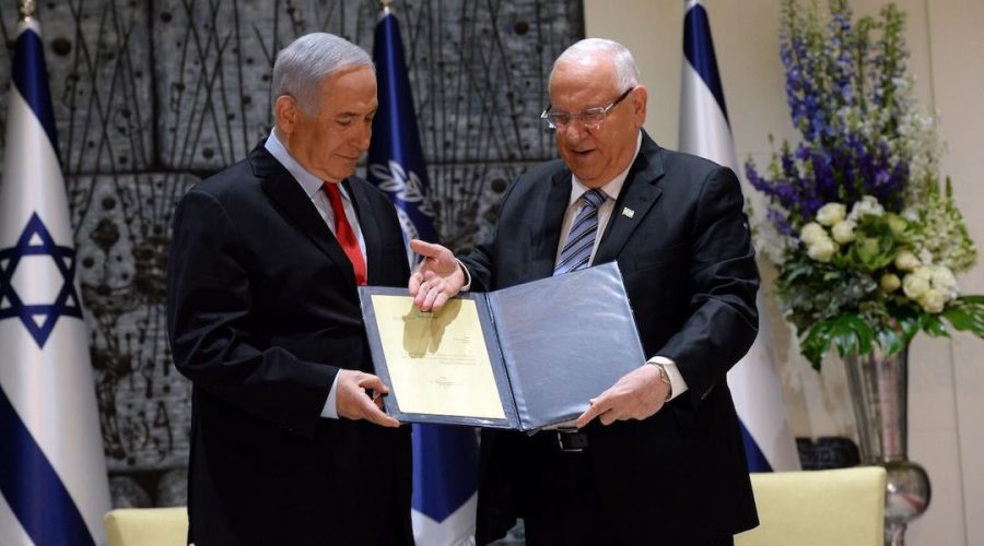 Israeli+President+Reuven+Rivlin%2C+right%2C+tasks+Benjamin+Netanyahu+with+forming+a+government+in+Jerusalem%2C+April+17%2C+2019.+Photo%3A+Haim+Zach%2FGPO