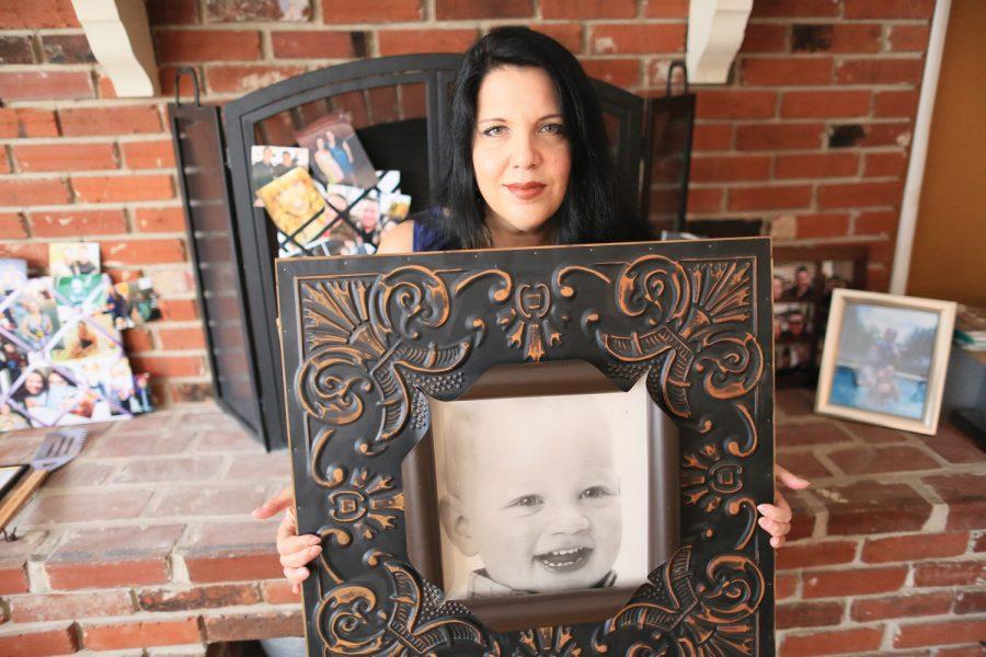 Jennifer Rothman Mancuso holds a photograph of her son, Vincent Joseph “VJ” Mancuso, who passed away in 2010 shortly before his fourth birthday. Mancuso started a foundation in VJ’s memory, which supports four local nonprofit organizations. Photo: Bill Motchan