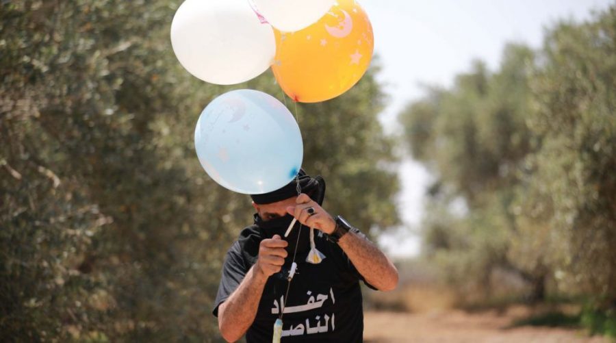 A+Palestinian+youth+in+Gaza+prepares+Molotov+cocktails+attached+to+balloons+to+set+fire+to+Israeli+land%2C+May+31%2C+2019.+%28Hassan+Jedi%2FFlash90%29%C2%A0