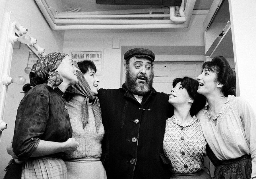 At left, Maria Karnilova, Tanya Everett, Zero Mostel, Julia Migenes and Joanna Merlin are shown backstage on the opening night of Fiddler on the Roof on Sept. 22, 1964. Above, the Imperial Theater in 1964. Photo: Associated Press/Courtesy of Roadside Attractions and Samuel Goldwyn Films