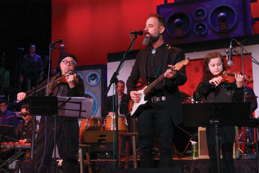 From left, Stuart Rosenberg, Jeff Lazaroff  and his daughter Daisy Lazaroff perform at last year’s Hanukkah Hullabaloo. File Photo: Eric Berger