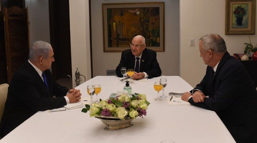 Israeli President Reuven Rivlin, center, meets with Prime Minister Benjamin Netanyahu, left, head of the Likud party, and Benny Gantz, chair of Blue and White, to discuss forming an emergency unity government, March 15, 2020. (Koby Gideon/GPO)