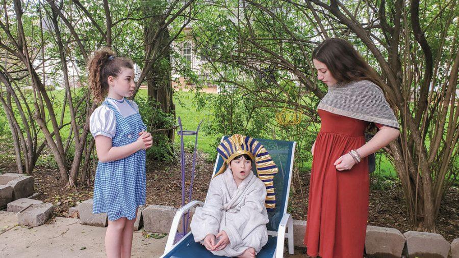 From left, Leora, Yehuda and Tzofia Dean family take part in a Passover play they wrote, directed and edited while learning at home. 
