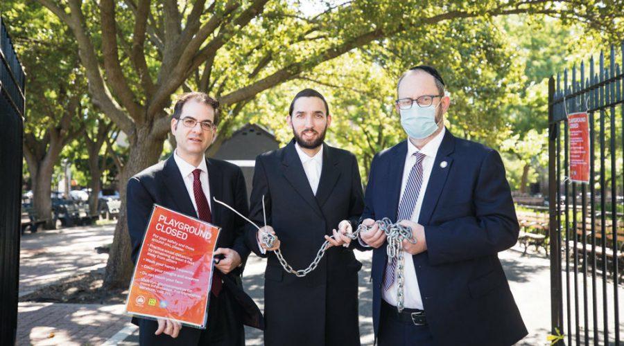 From left, City Councilman Kalman Yeger, New York State Assemblyman Simcha Eichenstein and State Sen. Simcha Felder open up Kolbert Playground in Brooklyn on June 16.  