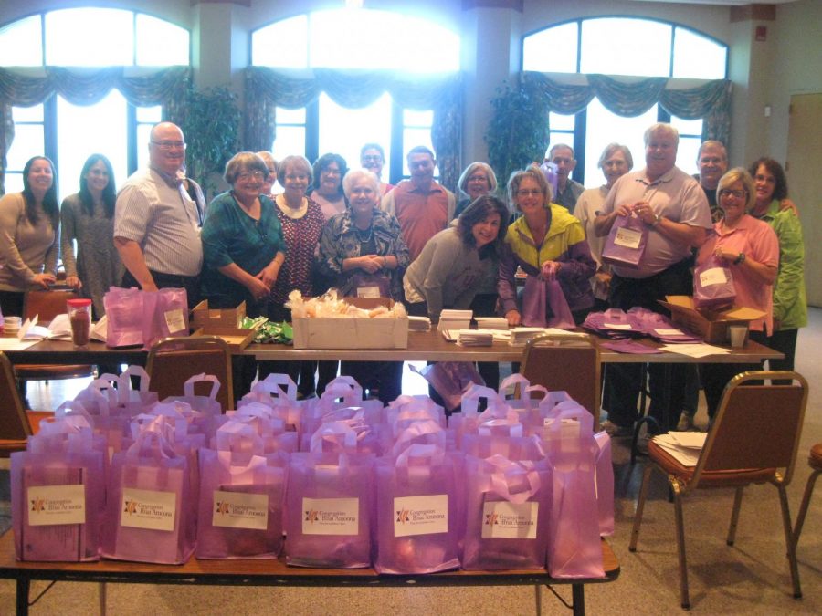 Volunteers came together at a gift packing event for Shomrei Amoonim with a group of B’nai Amoona members.