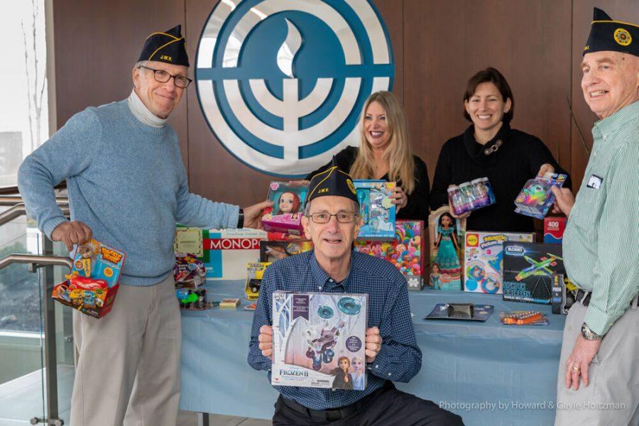 In this file photo, Jewish War Veterans Post 644 donates toys the organization collected  to the Hanukkah Hugs program organized by Women’s Philanthropy and Jewish Family Services. Pictured here are Harvey Bloth, Howard Holtzman, Pam Super, Lauren Gelber and Larry Chervitz. Photo: Howard Holtzman