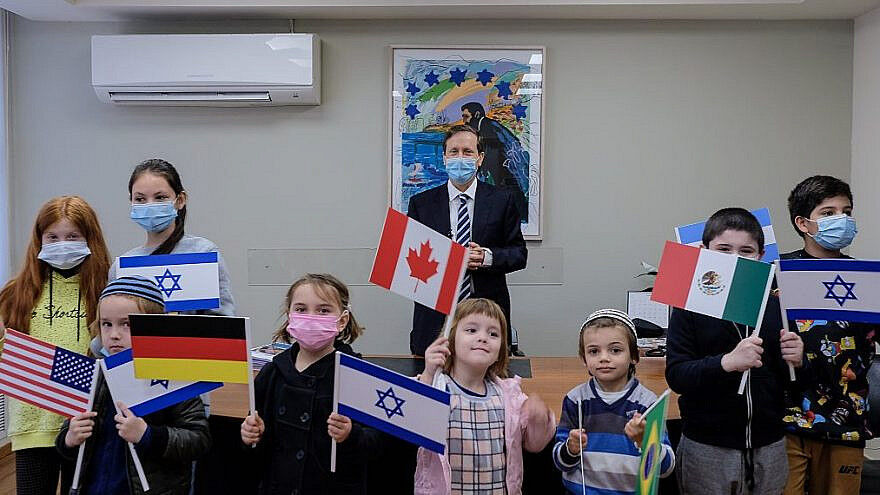 Jewish Agency chairman Isaac Herzog with a group of immigrant children, on Sunday, Dec. 27, 2020. Photo courtesy of David Salem.