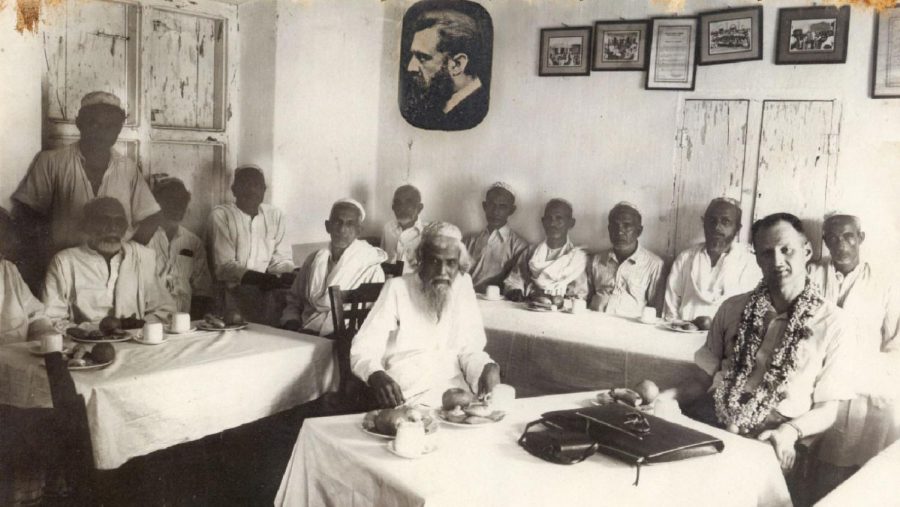 A historic photograph showing Jewish community leaders meeting with an emissary from Israel in Ernakulam, India. Photo courtesy of the Cochin Jewish Heritage Center.