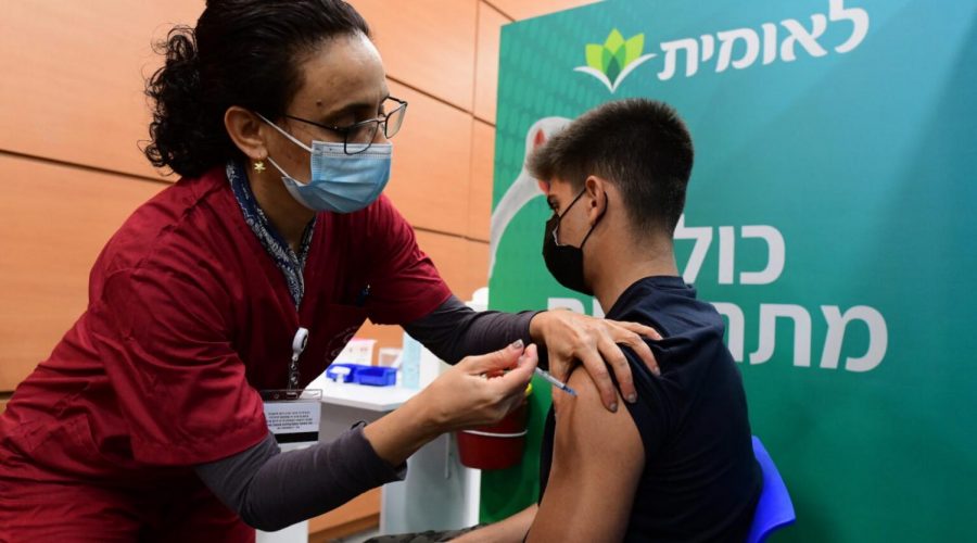 An+Israeli+student+receives+a+COVID-19+vaccine+injection+at+a+vaccination+center+in+Tel+Aviv%2C+Jan.+23%2C+2021.+%28Avshalom+Sassoni%2FFlash90%29