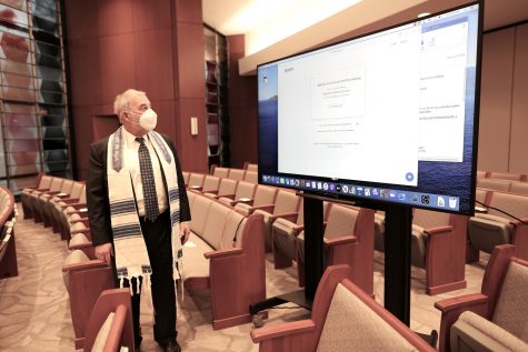 Rabbi James Bennett of Congregation Shaare Emeth gets ready for Shabbat services that would be live-streamed to congregants on Jan. 8.