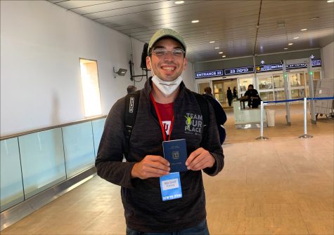 Michael Vivier, 25, shows off his new immigrant card upon arrival at Tel Aviv’s Ben Gurion Airport, Sept. 2, 2020. (Courtesy of Vivier)