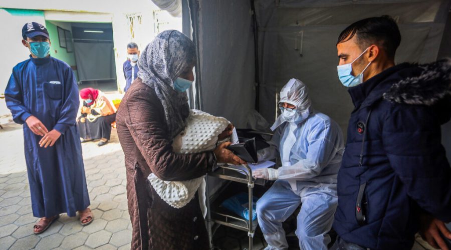 Palestinians wait to be tested for the coronavirus at a health center in Rafah, in the southern Gaza Strip, Jan. 5, 2020. (Abed Rahim Khatib/Flash90) 