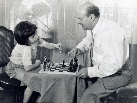 “You see Miri, I was really a famous artist before the war. I was known for these portraits.” Miriam Friedman Morris with her father, the chess enthusiast and portraitist, David Friedmann. St. Louis, 1957