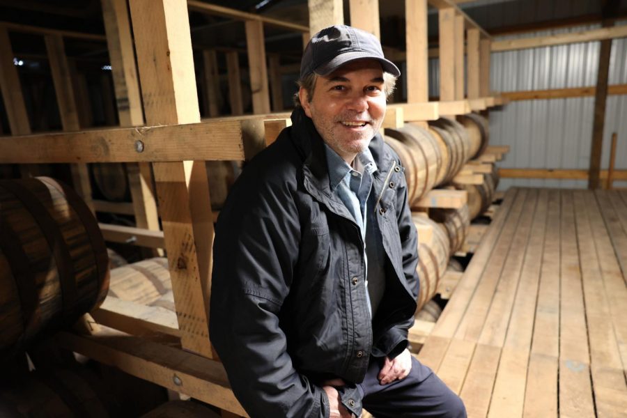 David Hermelin is shown with the barrels used to age Hermelin's Righteous Seven Barrel Reserve liqueur. Photo: Bill Motchan