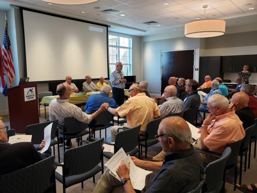 Harvey Gerstein speaks in September 2019 at the Mirowitz Center during a kickoff event for Friends Enjoying Life, a group Gerstein formed to provide social opportunities for active senior men.