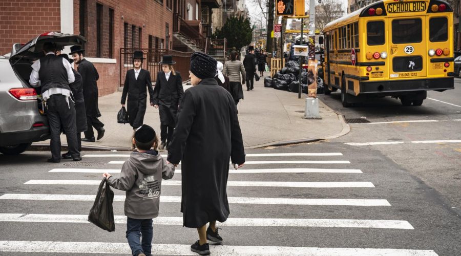 NEW YORK, NY - APRIL 9: Pedestrians walk near the Yeshiva Kehilath Yakov School in the South Williamsburg neighborhood, April 9, 2019 in the Brooklyn borough of New York City. New York City has ordered all yeshivas in a heavily Orthodox Jewish section of Brooklyn to exclude from classes all students who arent vaccinated against measles or face fines or possible closure. The order comes amid a recent outbreak of over 285 measles cases in Brooklyn and Queens, most of which have been concentrated in the Orthodox Jewish communities. (Photo by Drew Angerer/Getty Images)