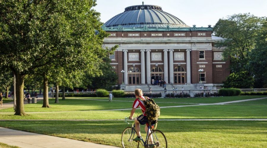 A student bikes across campus at the University of Illinois at Urbana-Champaign. (Jeffrey Greenberg/Universal Images Group via Getty Images)