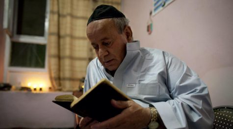 KABUL, AFGHANISTAN - SEPTEMBER 18: Zebulon Simantov reads his old tatered hebrew prayer book as he celebrates the Jewish New Year feast of Rosh Hashanah September 18, 2009 in Kabul, Afghanistan. Zebulon, 57, claims to be the last Jew living in the war-torn conservative Muslim country and says he keeps a Kosher home. The Jewish New Year, or Rosh Hashanah, coincides this year with Eid al-Fitr, a Muslim feast marking the end of the fasting month of Ramadan. Born in northwestern Herat, Simantov attended Hebrew school before moving to Kabul at age 27. In 1992, he fled to Tajikistan, fleeing from Afghanistans growing violence, married a Tajik Jew and had two daughters. The family immigrated in 1998 to Israel, but he returned to Kabul two months later, leaving them behind. (Photo by Paula Bronstein/Getty Images)
