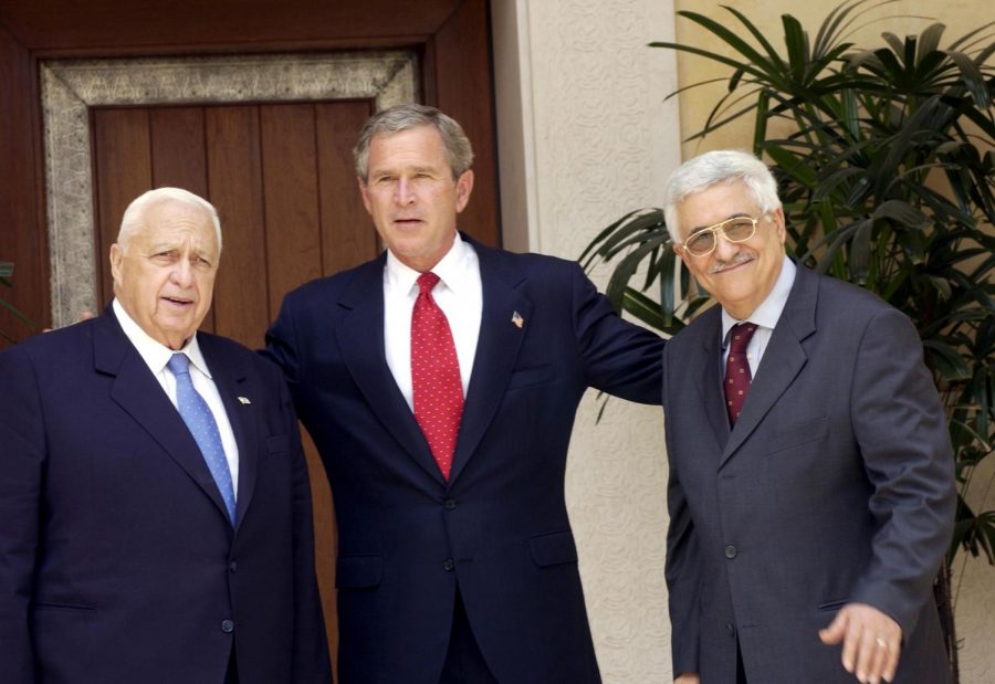 President George W. Bush brings together Israeli Prime Minister Ariel Sharon (left) and Palestinian Authority President Mahmoud Abbas at a summit in Aqaba, Jordan, in June 2003.