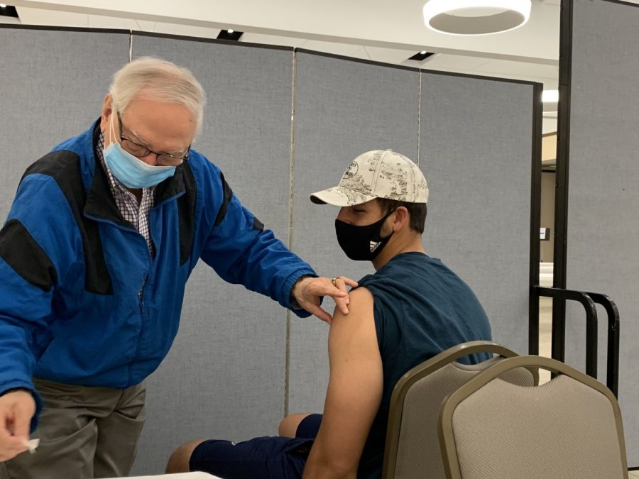 Dr. Gary Sherman administers the Pfizer COVID-19 vaccine to Jeremy Boonshaft on Sunday, April 25 at Congregation Shaare Emeth in Creve Coeur.