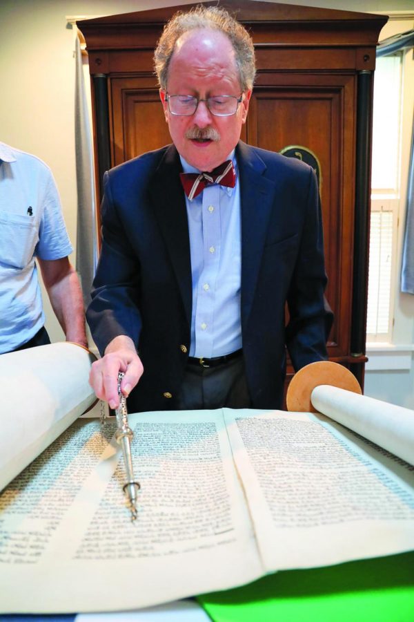 Rabbi Lane Steinger leads Friday night services at Temple Israel of Godfrey, Ill., in August 2019.