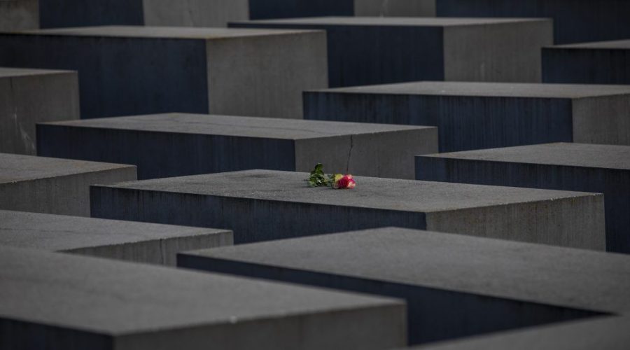 A+rose+is+placed+on+the+Holocaust+Memorial+on+the+International+Holocaust+Remembrance+Day+on+January+27%2C+2021+in+Berlin%2C+Germany.+%28Maja+Hitij%2FGetty+Images%29