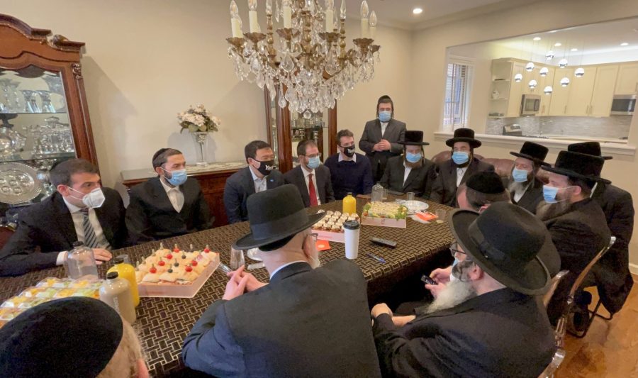 New York City mayoral candidate Andrew Yang, top, third from left, meets with haredi Orthodox Jewish leaders in Borough Park, Brooklyn, in an undated photo supplied by his campaign. (Yang for New York)