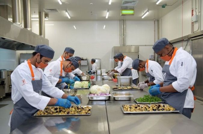 Kosher Arabia’s team of chefs preparing food in their facility (Facebook)