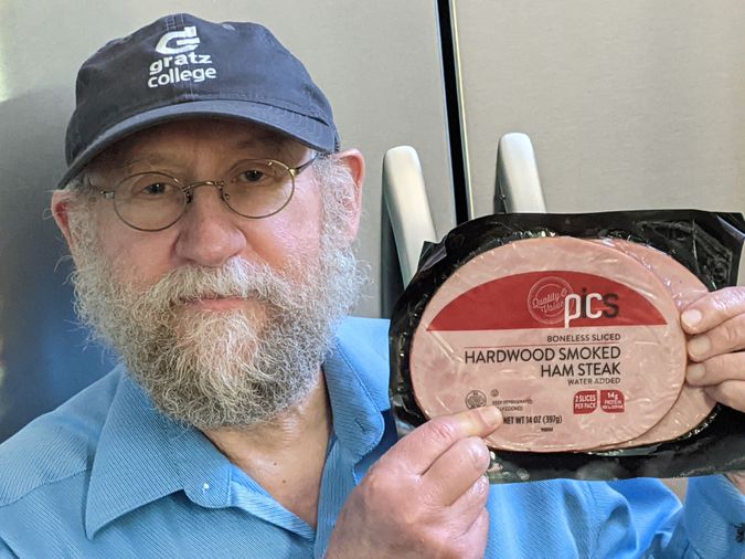 Courtesy of Paul Finkelman

Paul Finkelman holds a package of “kosher” ham.