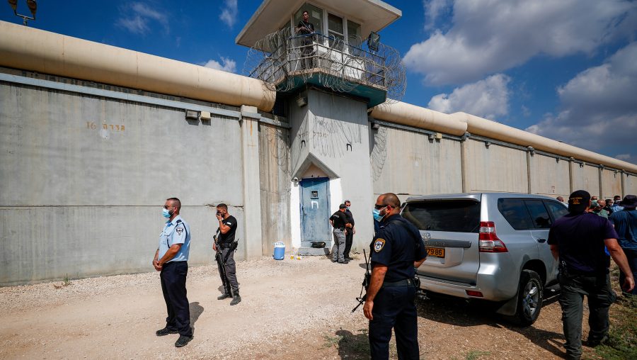 Police officers and prison guards inspect the scene of a prison escape of six Palestinian prisoners outside the Gilboa Prison in northern Israel, Sept. 6, 2021. (Flash90)
