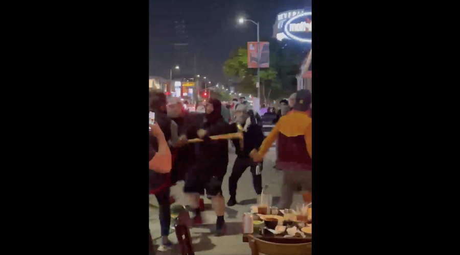 Pro-Palestinian demonstrators are captured on cellphone video physically attacking Jews at a restaurant in Los Angeles, May 18, 2021. (Screenshot)