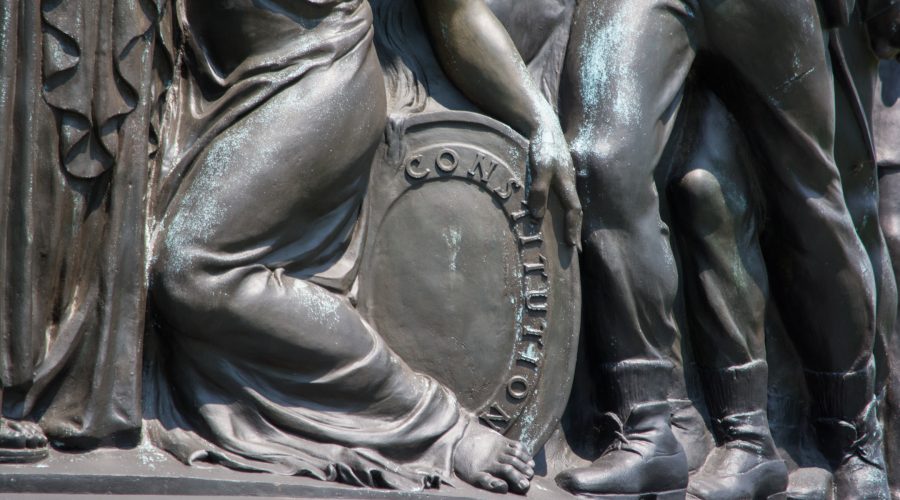The Confederate Memorial at Arlington National Cemetery includes the image of a woman protecting a shield emblazoned with the word Constitution. (Tim Evanson/Flickr Commons)