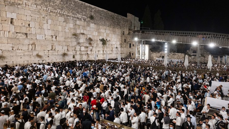 Jews pray for forgiveness, or selichot, at the Western Wall in the Old City of Jerusalem, a day before the Jewish New Year, Sept. 5, 2021 (Yonatan Sindel/Flash90)