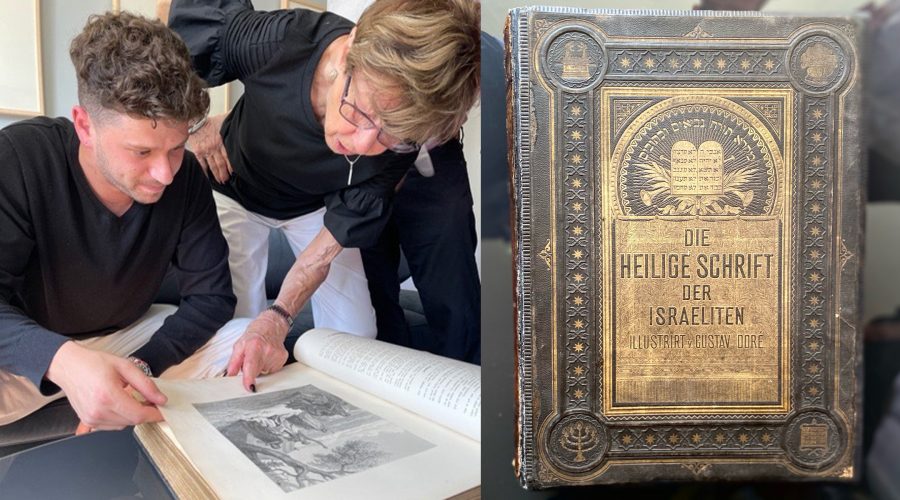 Jacob Leiter and his grandmother, Susi Kasper Leiter, examine an heirloom Bible that had been hidden by family members during the Holocaust, June 9, 2021. (USHMM)