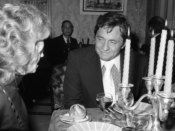ohnny Cash in conversation with a guest at the reception in his honor in Jerusalem, November, 1971. Photo by IPPA Staff, the Dan Hadani Collection, the Pritzker Family National Photography Collection at the National Library of Israel