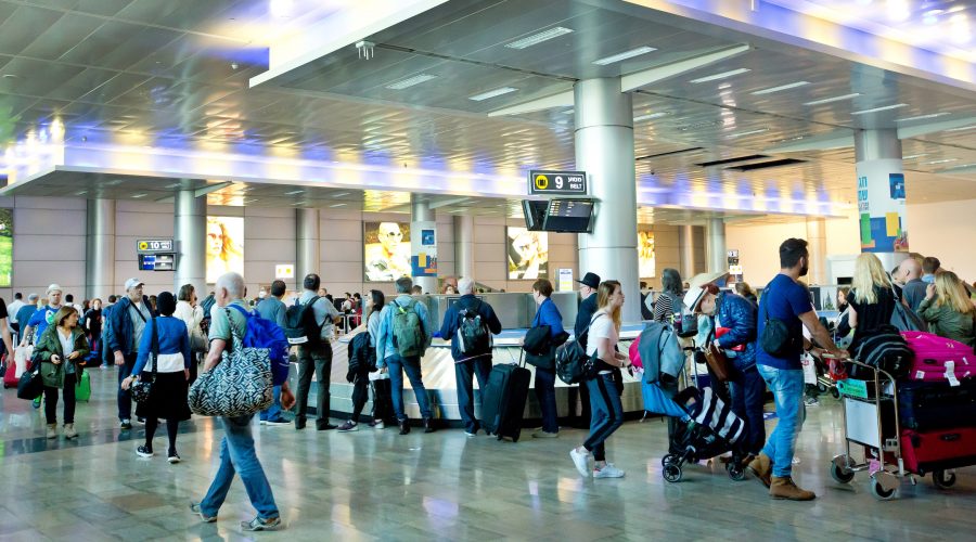 Travelers at Ben-Gurion Airport in Tel Aviv in 2018 (Moshe Shai/Flash90)