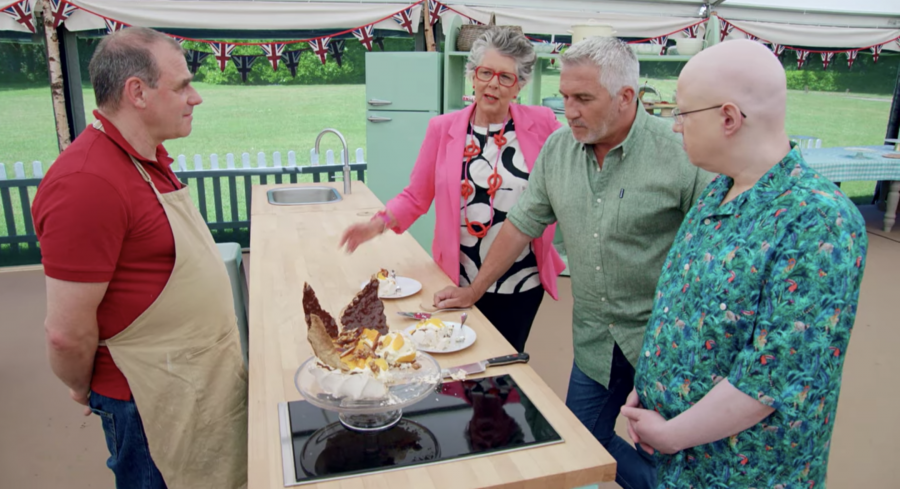 Jurgen Krauss, who bakes challah for his familys synagogue, shows off his Passover-inspired pavlova in The Great British Baking Show tent. (Screenshot from Netflix)