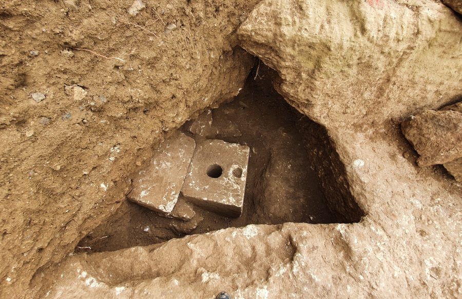 The toilet was carved from limestone and was built with a septic tank underneath it. (Yoli Schwartz/Israel Antiquities Authority)