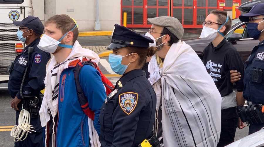 Rabbi+Guy+Austrian+of+the+Fort+Tryon+Jewish+Center+in+Upper+Manhattan%2C+in+hat+and+prayer+shawl%2C+is+among+those+arrested+for+blocking+the+West+Side+Highway+in+a+protest+demanding+action+on+climate+change%2C+Oct.+25%2C+2021.+%28Courtesy+William+Bozian%29