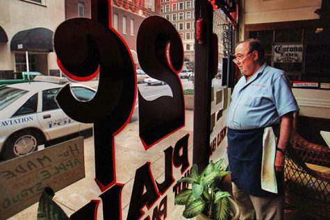 Jack Carl, owner of Two Cents Plain, a New York-style deli in St. Louis,  stands behind the counter at the deli Wednesday, March 9, 2005. Call it the  big basketball event. Call