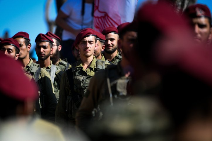 Israeli soldier from the Paratroopers Brigade, some of them ultra orthodox Jewish man during a swearing-in ceremony for the Paratroopers Brigade, at Ammunition Hill in Jerusalem on November 11, 2021. Photo by Arie Leib Abrams/Flash90 