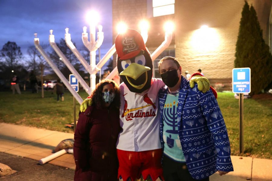 Fredbird helps light the menorah