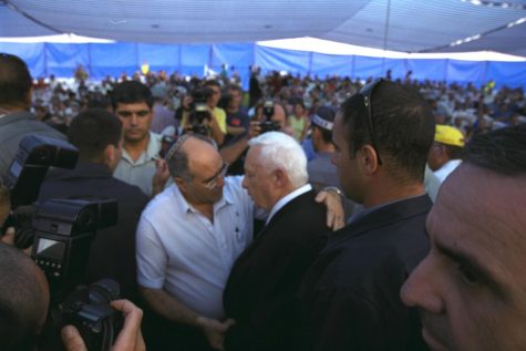 Prime Minister Ariel Sharon meets with the father of abducted soldier Benny Avraham during a military memorial service in September 2001. In January 2004, Sharon approved an exchange that brought Avraham’s body, along with those of two other soldiers captured and killed by Hezbollah, back to Israel. Photo: Moshe Milner, Israeli Government Press Office